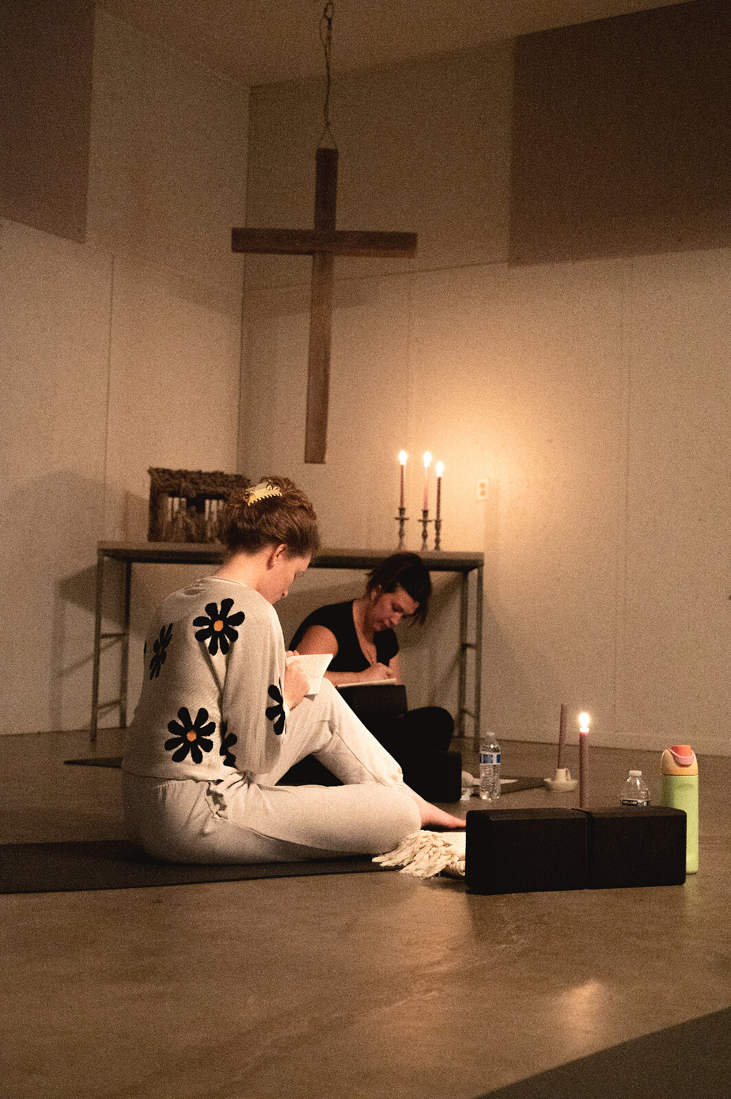 Quiet prayer and journaling by candlelight